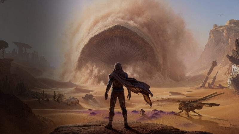 Dune: Awakening key art showing a stillsuited character on Arrakis